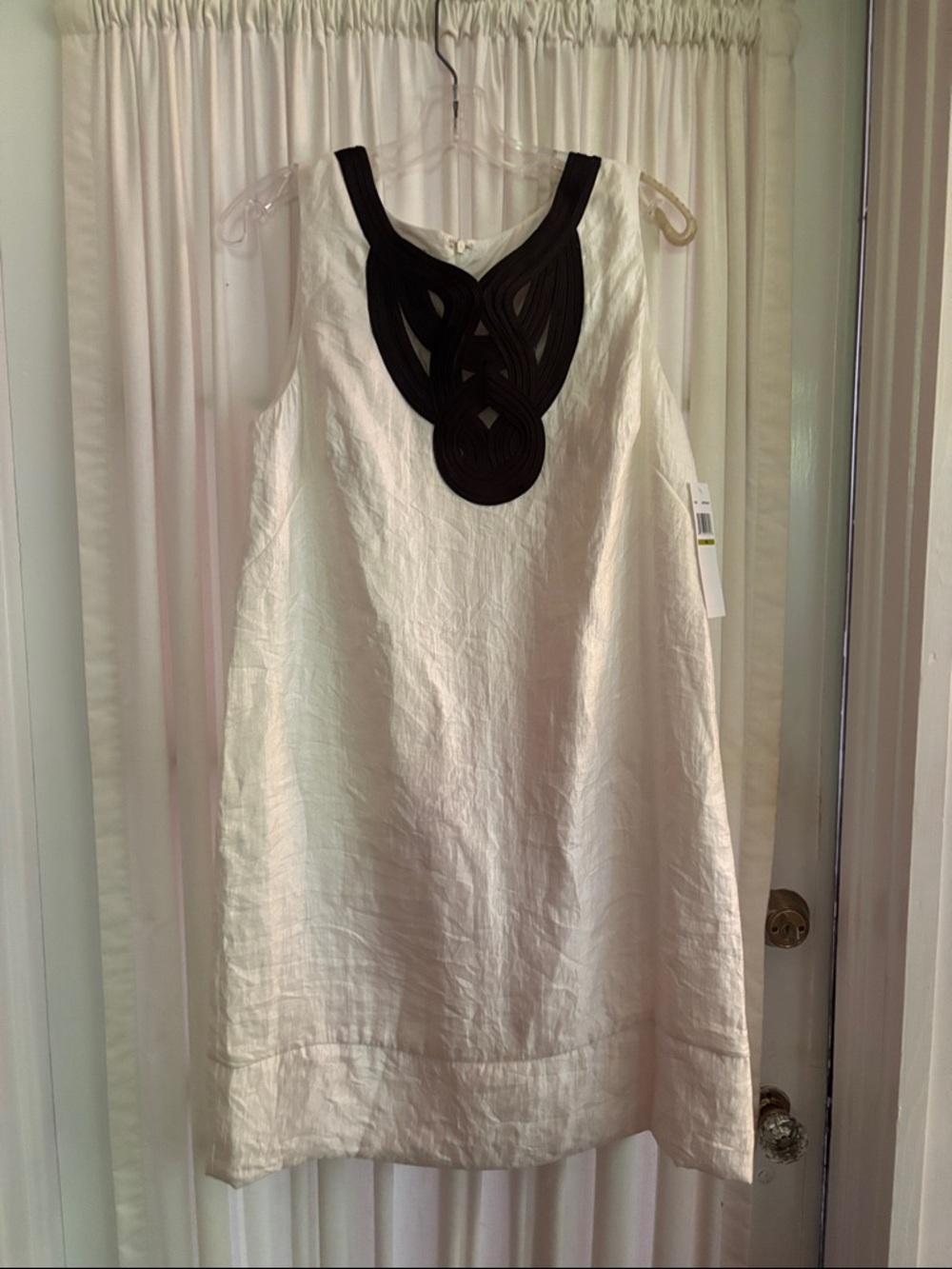Maggie London ivory dress with black bib
New with tags; check pics